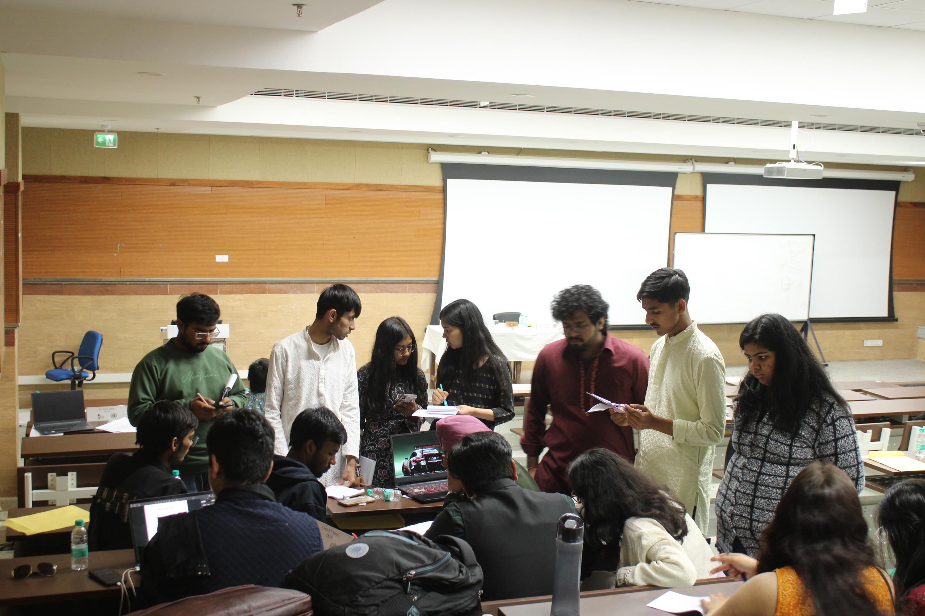Delegates collaborating during unmoderated caucus